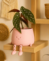 mini happy pot rosa pastel contexto